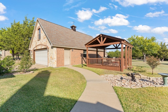 view of community with a gazebo, a deck, and a lawn