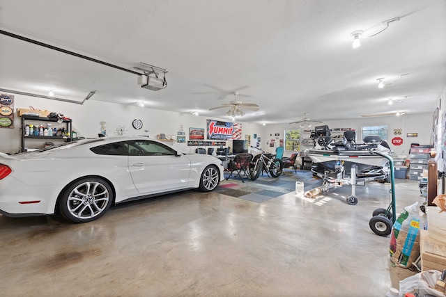 garage with ceiling fan and a garage door opener