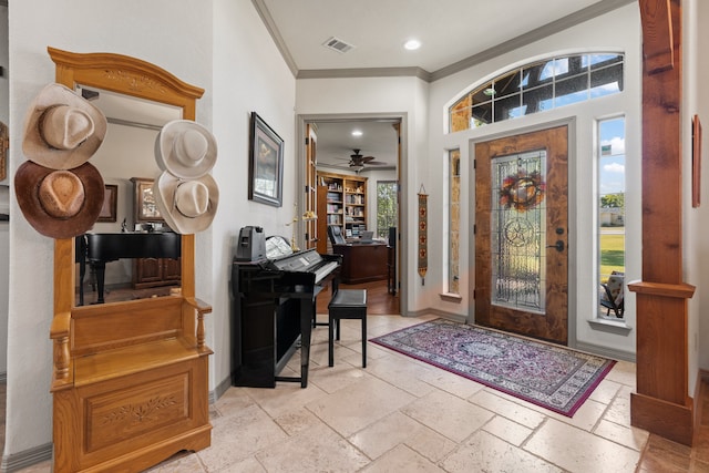 foyer featuring crown molding and ceiling fan