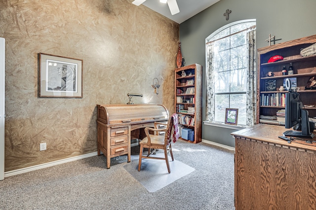 carpeted home office with vaulted ceiling, a healthy amount of sunlight, and ceiling fan