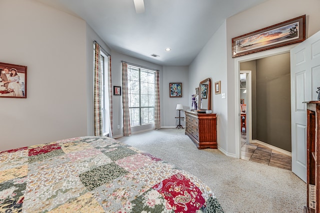 bedroom with ceiling fan and light colored carpet