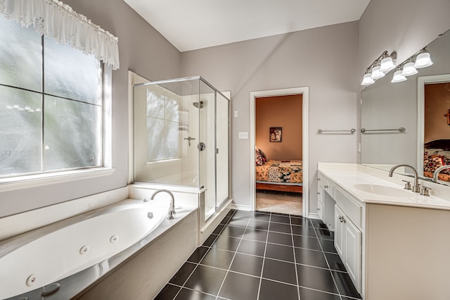 bathroom with vanity, tile patterned floors, and plus walk in shower