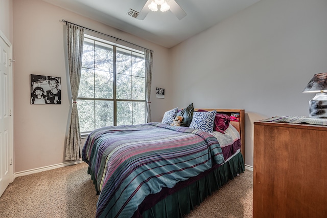 bedroom featuring lofted ceiling, carpet flooring, and ceiling fan