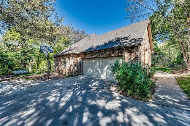 view of side of home with a garage