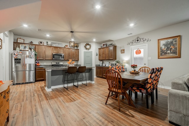 dining room featuring light wood-type flooring