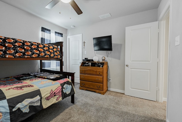 bedroom featuring ceiling fan and light colored carpet