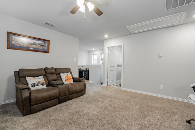 living room featuring ceiling fan and light carpet