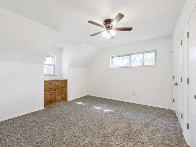 bonus room with vaulted ceiling, carpet, and a wealth of natural light