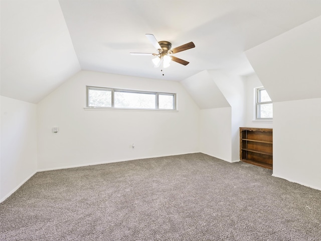 bonus room with carpet, vaulted ceiling, and ceiling fan