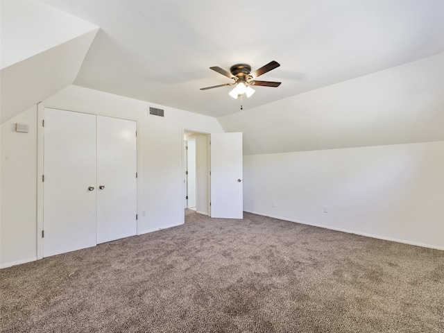 additional living space featuring ceiling fan, lofted ceiling, and carpet floors