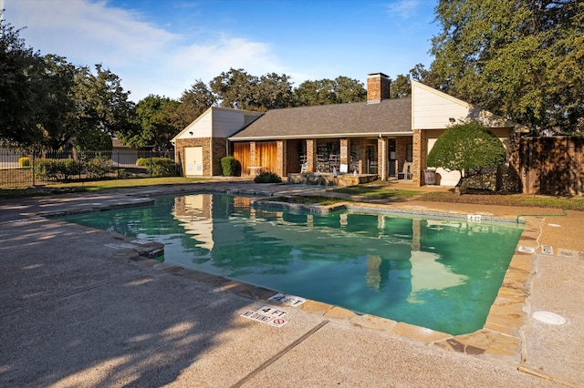 view of swimming pool with a patio