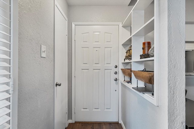 doorway with dark hardwood / wood-style flooring