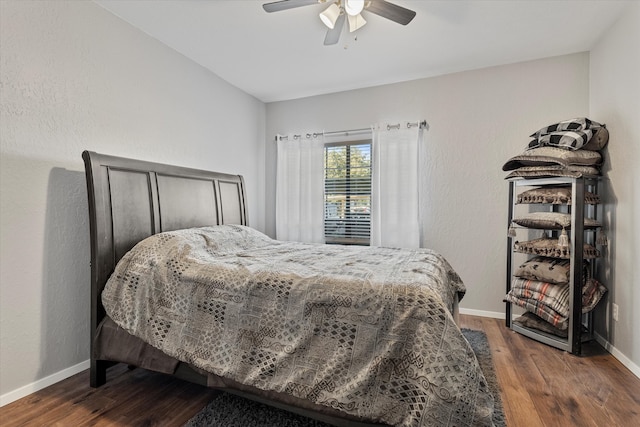 bedroom featuring ceiling fan and dark hardwood / wood-style floors