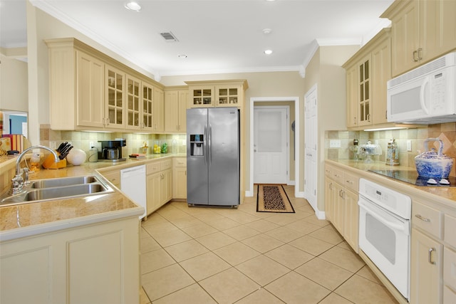 kitchen featuring decorative backsplash, sink, crown molding, light tile patterned floors, and white appliances