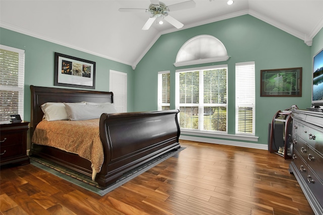 bedroom featuring dark hardwood / wood-style flooring, lofted ceiling, crown molding, and ceiling fan