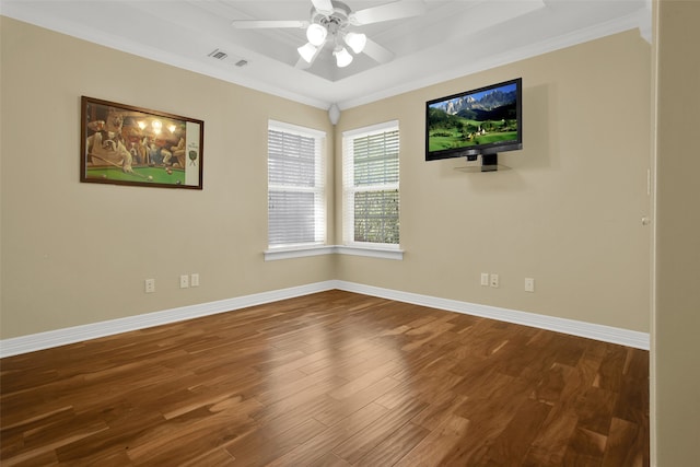 empty room with crown molding, hardwood / wood-style flooring, and ceiling fan