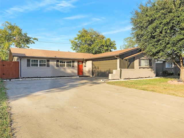 ranch-style home featuring a garage