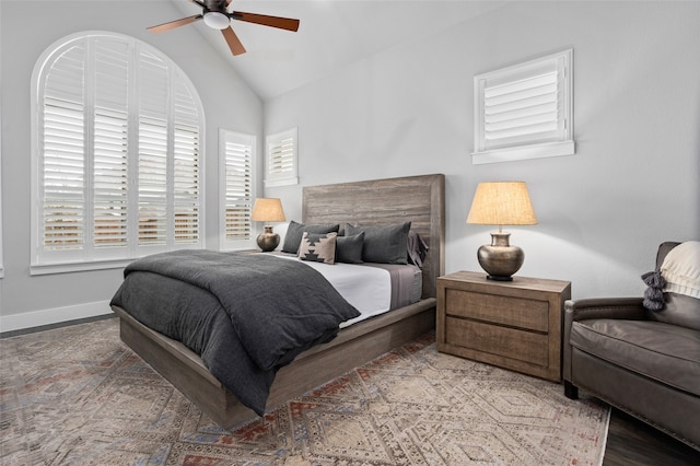 bedroom featuring lofted ceiling, wood-type flooring, and ceiling fan