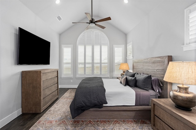 bedroom with multiple windows, high vaulted ceiling, dark wood-type flooring, and ceiling fan