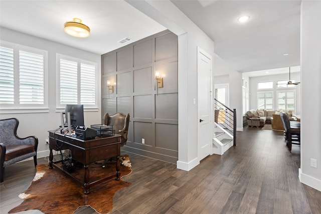 home office with a wealth of natural light and wood-type flooring