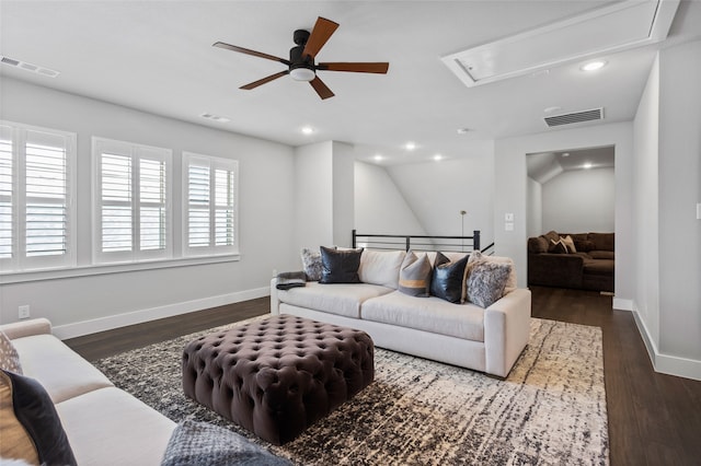 living room featuring ceiling fan, lofted ceiling, and dark hardwood / wood-style floors