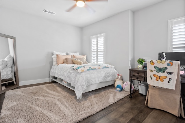 bedroom with dark wood-type flooring and ceiling fan