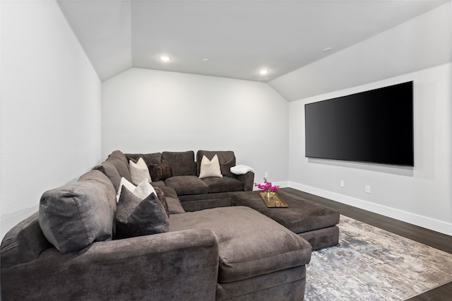 living room featuring lofted ceiling and hardwood / wood-style flooring