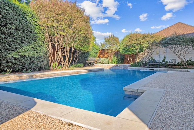 pool with a patio area