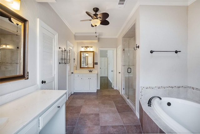 bathroom with ceiling fan, crown molding, vanity, and plus walk in shower