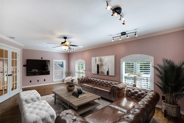 living room featuring french doors, rail lighting, crown molding, dark hardwood / wood-style floors, and ceiling fan