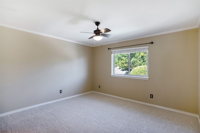 carpeted empty room with ceiling fan and ornamental molding