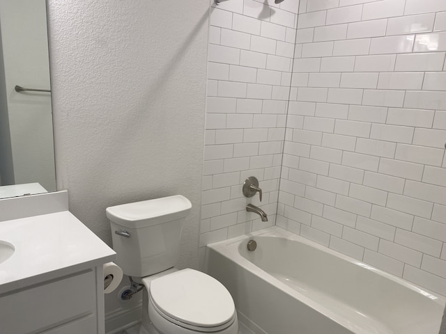 full bathroom with vanity, toilet, and tiled shower / bath