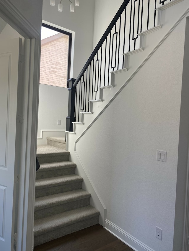 stairway featuring hardwood / wood-style flooring