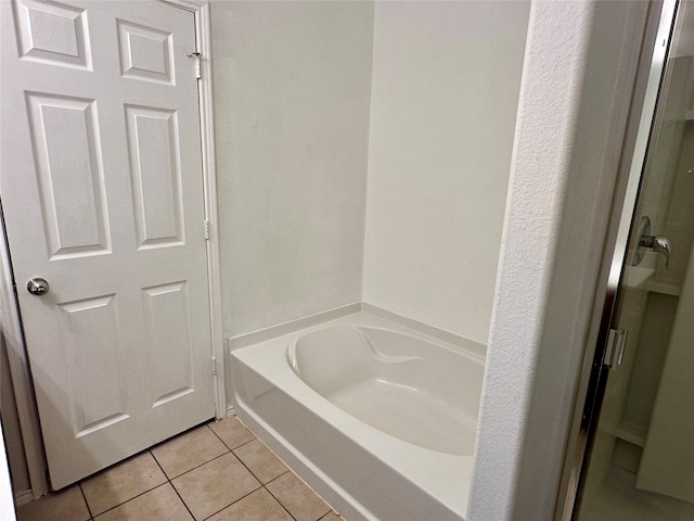 bathroom with tile patterned floors and separate shower and tub