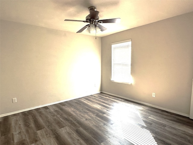 unfurnished room featuring ceiling fan and dark hardwood / wood-style flooring