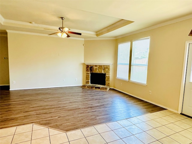 unfurnished living room featuring ornamental molding, ceiling fan, and light hardwood / wood-style floors