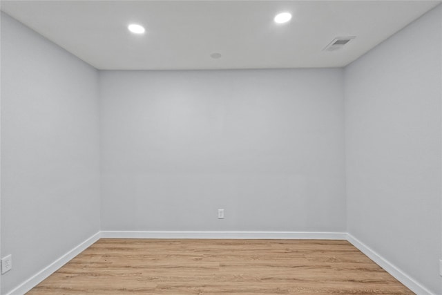 unfurnished room with hardwood / wood-style floors