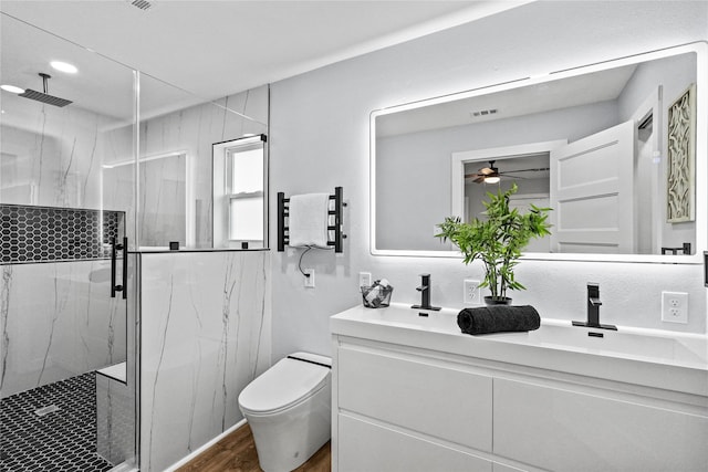 bathroom with vanity, toilet, wood-type flooring, and an enclosed shower