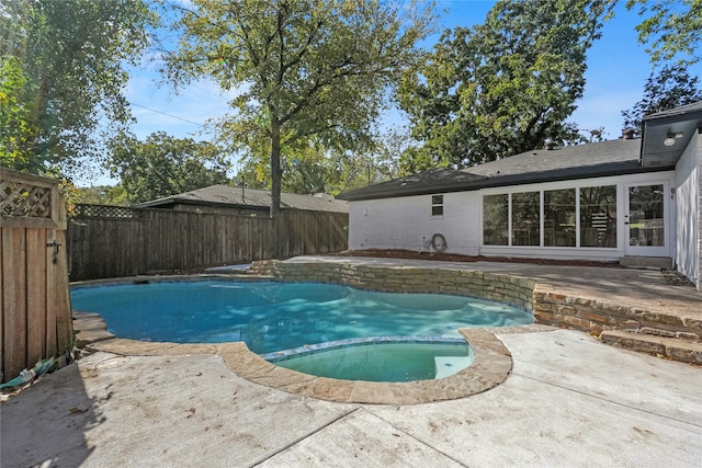 view of swimming pool featuring a patio area