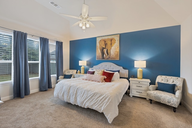 bedroom with multiple windows, light colored carpet, and ceiling fan