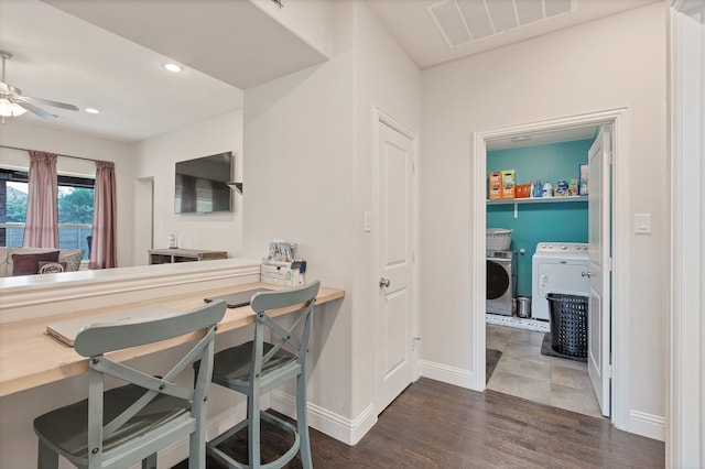 dining room with ceiling fan, dark hardwood / wood-style flooring, and independent washer and dryer