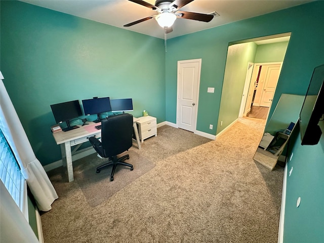 home office with ceiling fan and carpet floors