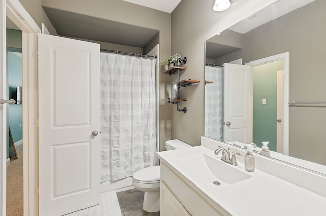 bathroom with toilet, vanity, tile patterned floors, and walk in shower