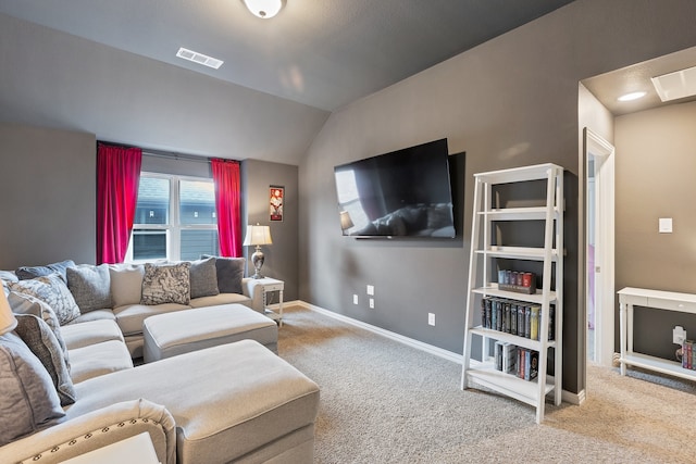 carpeted living room featuring lofted ceiling