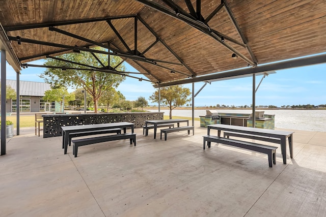 view of community featuring a water view and a gazebo