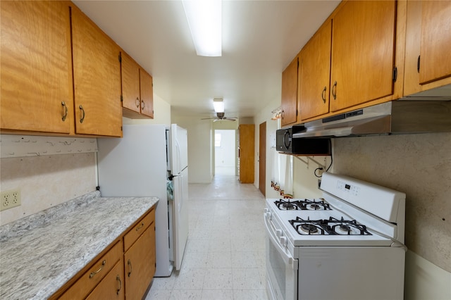 kitchen with white appliances and ceiling fan