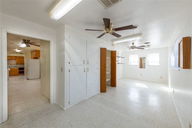 unfurnished room featuring sink