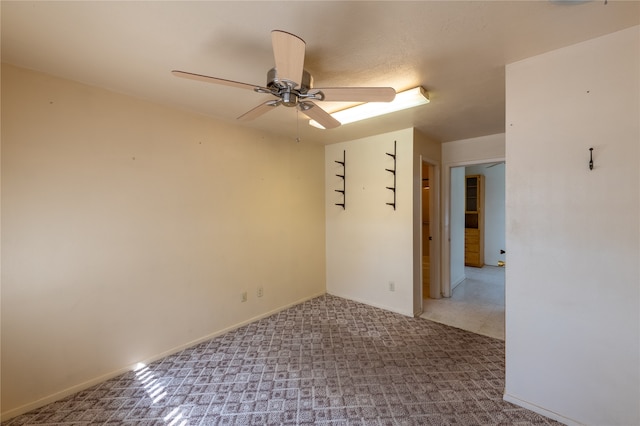 unfurnished room with ceiling fan