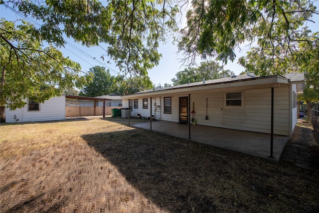 back of house featuring a patio area