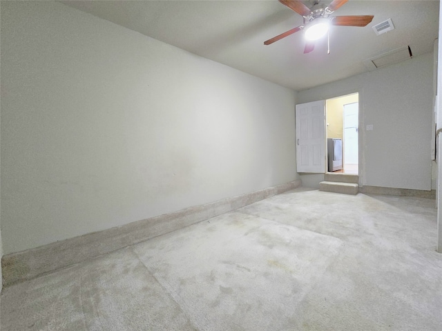 carpeted empty room featuring ceiling fan